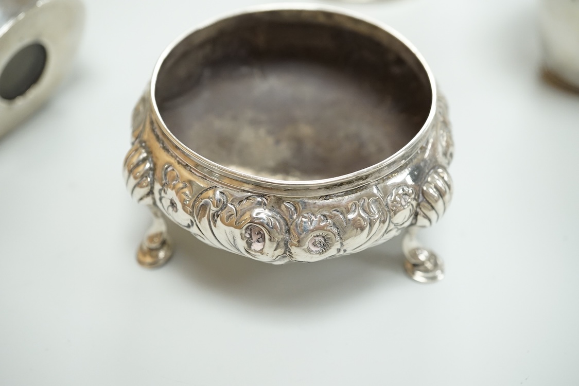 A Victorian silver drum mustard pot, a pair of later silver mustard pots and two silver salts including Victorian.